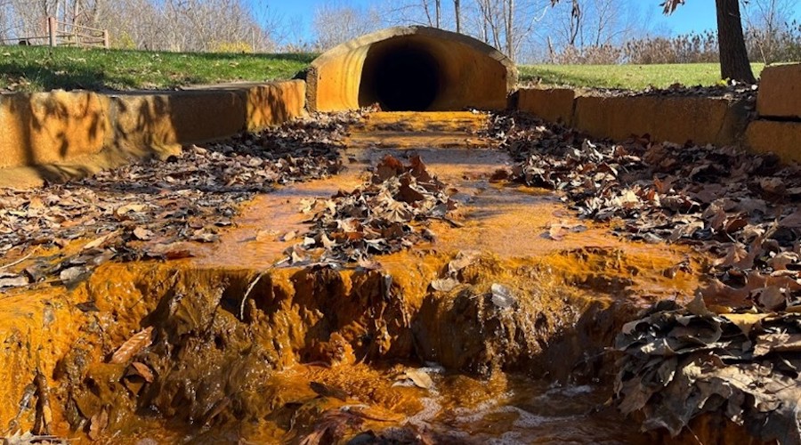 range water affected by acid mine drainage flows from a culvert at the Consolidated Coal No. 15 mine site, Illinois