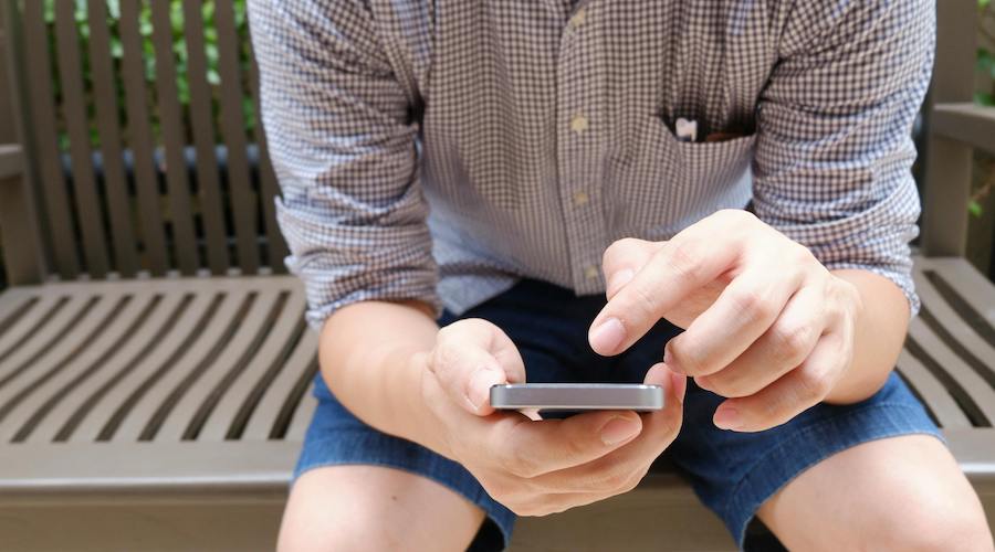Man looking at his cell phone